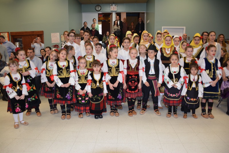 Serbian Orthodox children in traditional folk costumes at a parish gathering